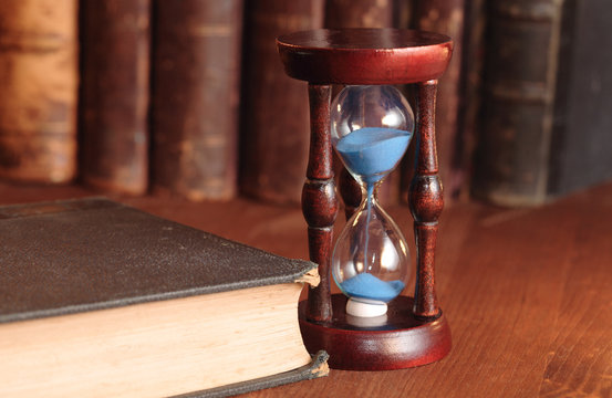 Hourglass And Old Books