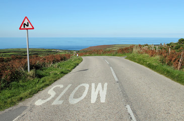 The B3306 road to the sea in Cornwall UK.