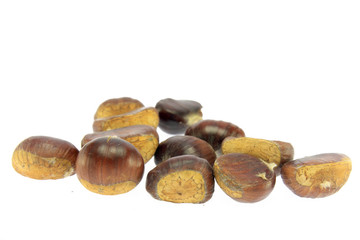 Isolated macro image of raw chestnuts