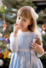 girl with ginger cookies - obrazy, fototapety, plakaty