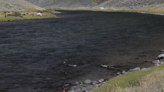Camp at mountain river Khovd in Mongolian Altai