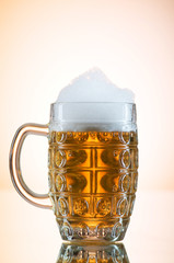 Beer glasses against the colorful gradient background