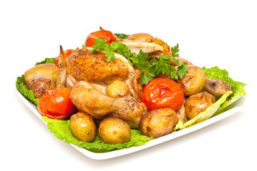 baked chicken with vegetables isolated
