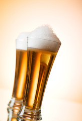 Beer glasses against the colorful gradient background