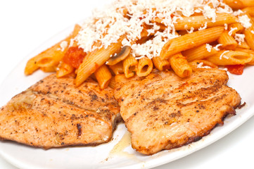 fried salmon with pasta topped with cheese