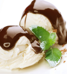 Ice cream with Chocolate topping.Dessert over white