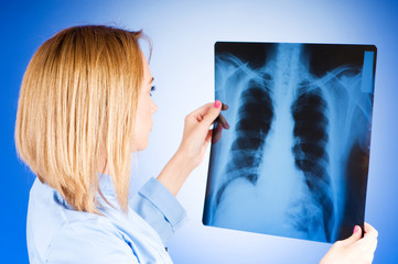 Female doctor carefully x-ray of patient