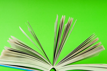 Stack of books on the color background