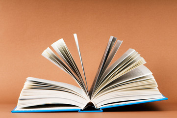 Stack of books on the color background