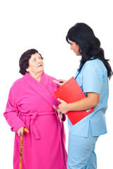 Fototapeta premium Doctor converse with elderly patient