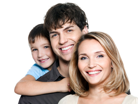 Faces of a happy young family on white background