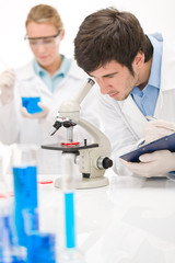 Naklejka na ściany i meble Flu virus experiment - scientist in laboratory