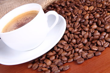 Cup of coffee and coffee beans