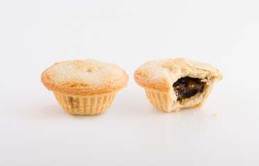 Two fruit pies, one bitten