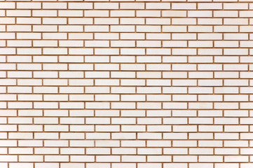 Beige colored fine brick wall texture background