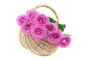Fototapeta na wymiar Pink Roses in a Wicker Basket