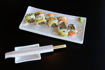 Traditional sushi rolls on the dish.