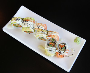 Traditional sushi rolls on the dish.