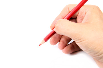 Hand holding a red pencil on white  background