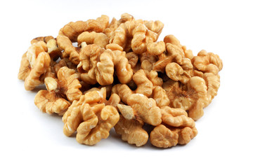 Cracked walnuts on white background