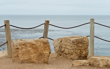 Large Sitting Stones Overlooking Ocean