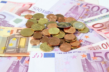 Euro bils with coins