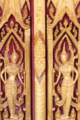 Buddhist art carving and painting on door of temple