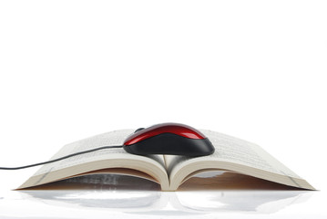 Book and mouse on white background