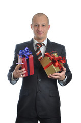 Businessman offering a gift isolated on white