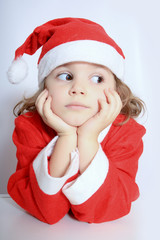 little girl in Santa's hat