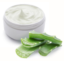 Opened plastic container with cream and aloe.