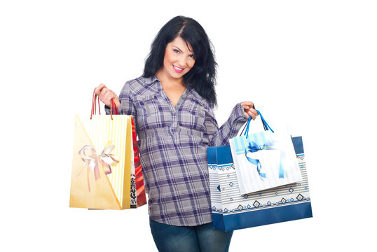 Happy woman holding shopping bags