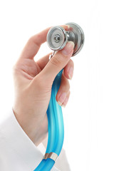 Hand with stethoscope isolated over white background.