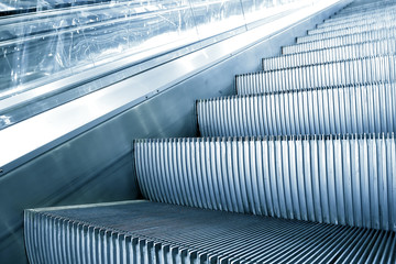 blue escalator in motion