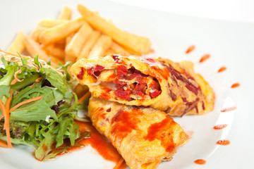 Tempting crepes with salad and fries