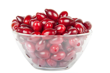 glass bowl with ripe Cornelian cherries
