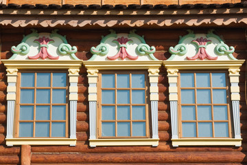 Three windows of old wooden house