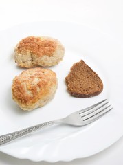 Fresh meatloaf (chop) in plate with bread and fork