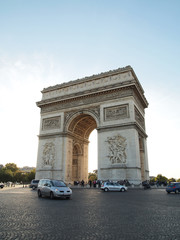 Fototapeta na wymiar Triumphal arch with street tourism Napoleon Bonaparte at Paris