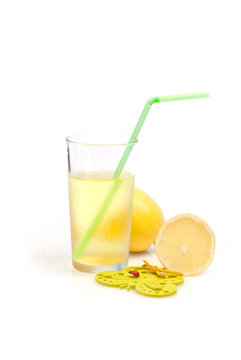 a glass of lemonade and lemon