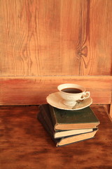 coffee cup and books