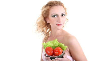 young woman with green salad an tomatoes