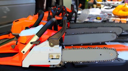 chain saw machines row perspective in market