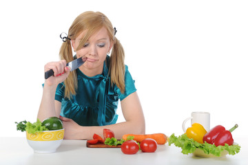 Beautiful housewife with a knife in his hand.