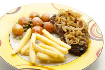 Kotelett mit Pommes Frites und Gemüse