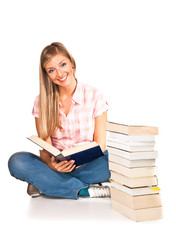 Young adult caucasian woman with books isolated on white