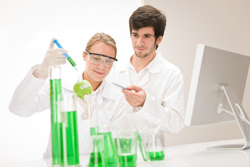 Genetic engineering - scientists in laboratory