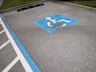 an image of handicap icon on the road