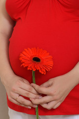Pregnant woman with a flower