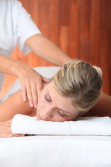 Obraz na płótnie Canvas Closeup of beautiful woman laying on a massage bed